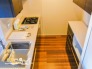 ※ご入居前の当時室内です。　ワークスペースを広々と確保できるカップボード付きキッチン♪対面式なので作業中もリビングを見守れ安心です♪